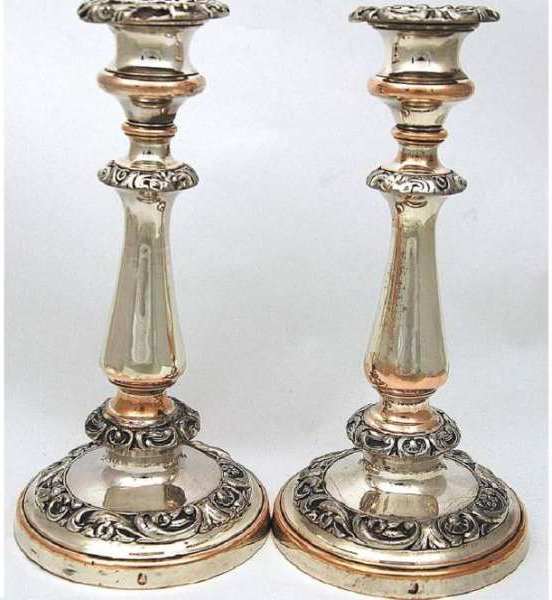 Samuel Roberts mark, a bell, on a pair of candlesticks by Roberts Cadman and Co.
